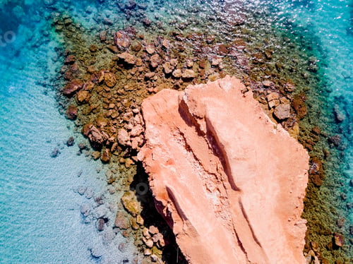 Preview: Transparent water Mediterranean coast with rocky bed, aerial view.