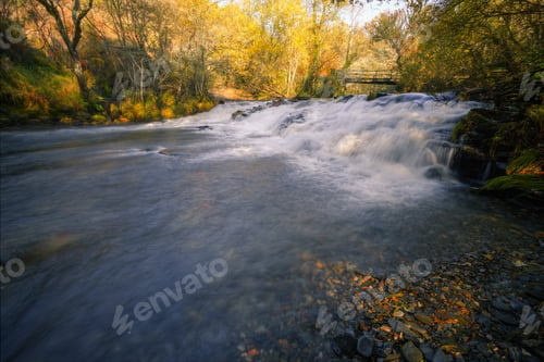 Preview: Waterfall over an old Artisanal Dam under a wooden Bridge