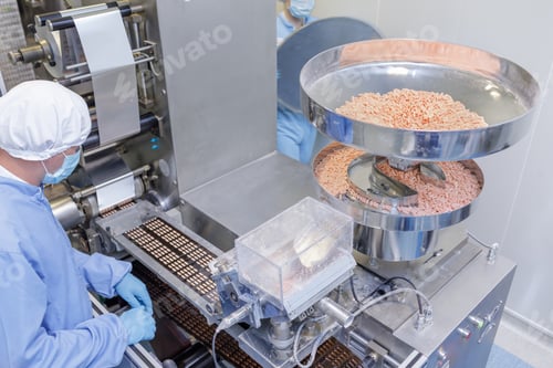 Preview: Tablet Packaging Line in Modern Pharmaceutical Manufacturing Facility with Automated Equipment
