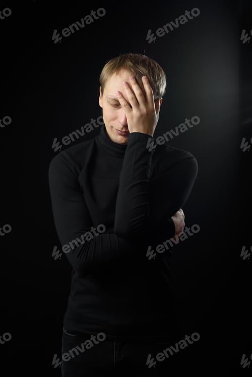 Preview: Close up portrait of a young man in a white shirt and black tie.