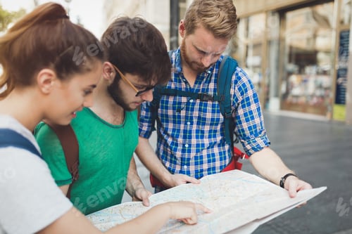 Preview: Young happy tourists sightseeing in city