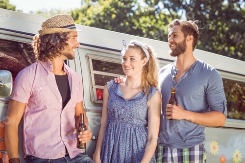 Preview: Hipster friends chatting and drinking on a summers day