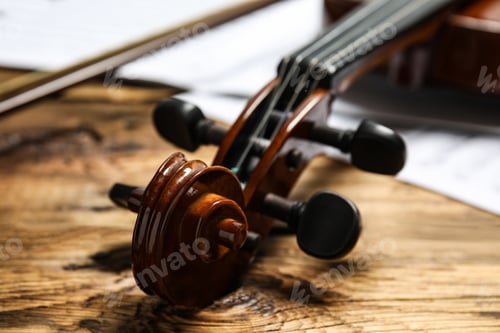 Preview: Classic violin on wooden background, closeup view