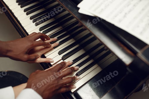 Preview: Ebony grand piano player hands on the keys