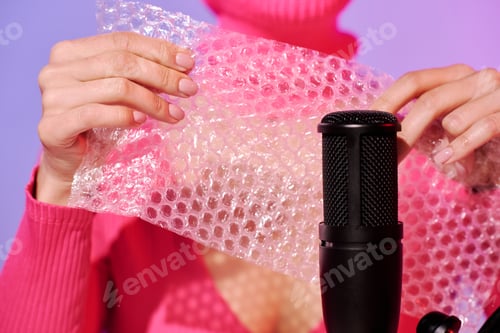 Preview: Woman Popping Bubble Wrap At Studio