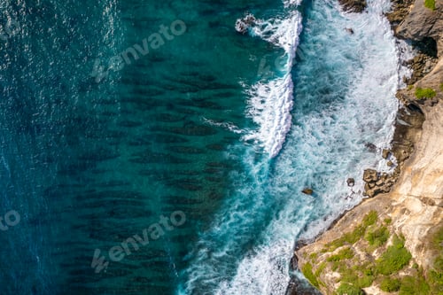 Preview: Top down of waves crashing in ocean near Uluwatu temple in Bali, Indonesia