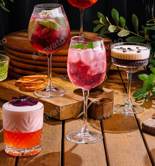 Preview: Assortment of colorful cocktails on rustic wooden surface