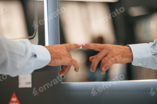 Preview: Close up view, touching smart mirror. Man is in the hardware shop