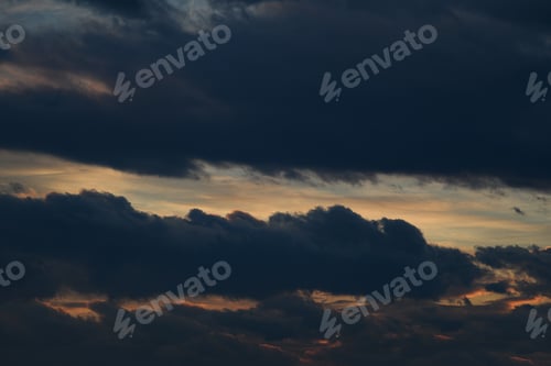 Preview: Dark evening sky. Bad weather. Fluffy clouds. Light breaks through the clouds.