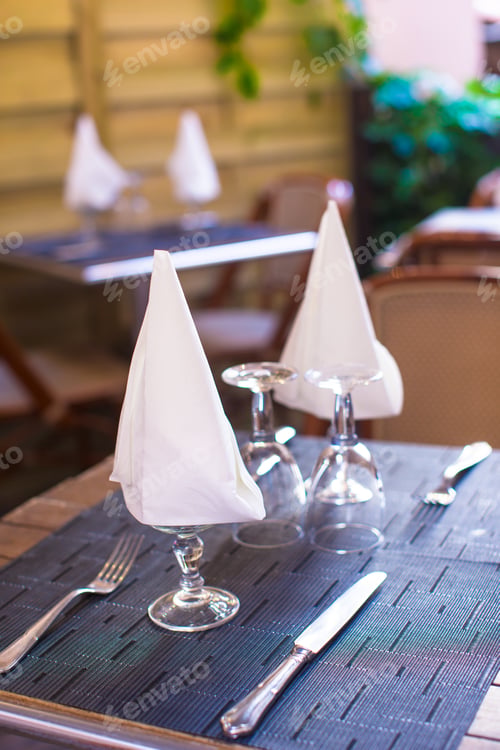 Preview: Served table set at outdoor cafe with perfect view