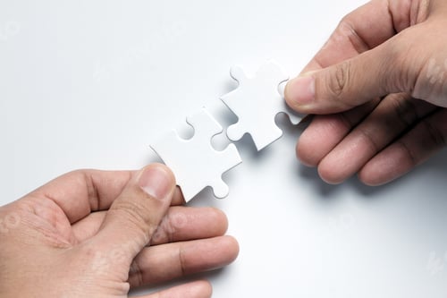 Preview: Partnership concept with hands putting puzzle pieces together