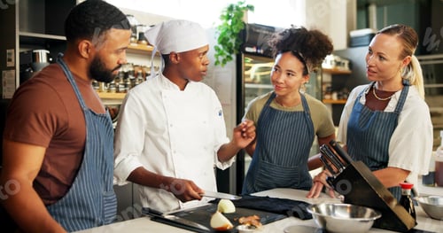 Preview: Cooking, course and chef teaching group in kitchen for knife skills, cutting technique and knowledg