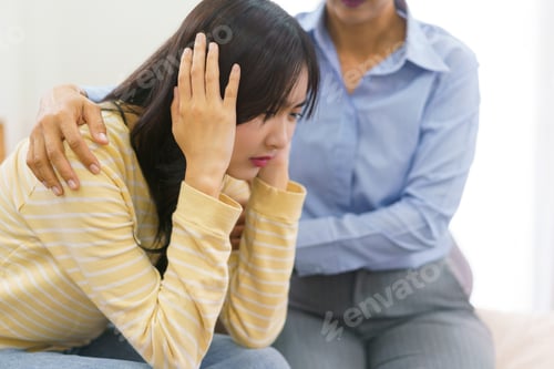 Preview: Female psychologist comforting and encourage stressed patient while listening her problem in office