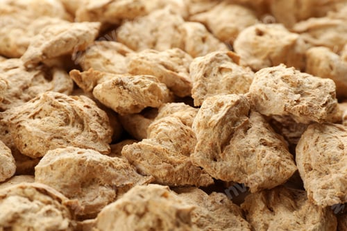 Preview: Dehydrated soy meat chunks as background, closeup