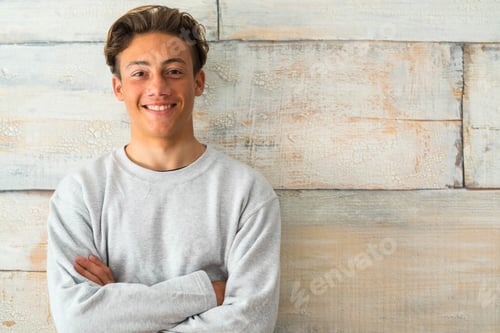 Preview: close up and portrait of teenager or boy smiling and looking at the camera