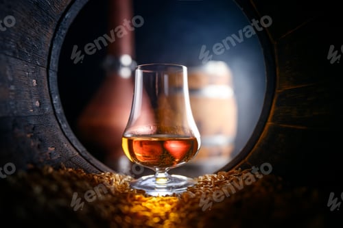 Preview: Tasting glass with whiskey standing inside of old oak barrel
