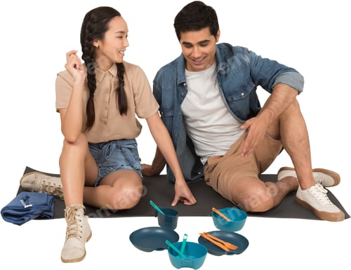 Preview: a man and a woman sitting on the floor with toys