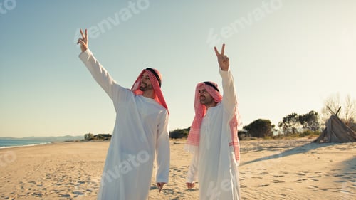 Preview: Two Sheiks Making The Victory Gesture In The Desert