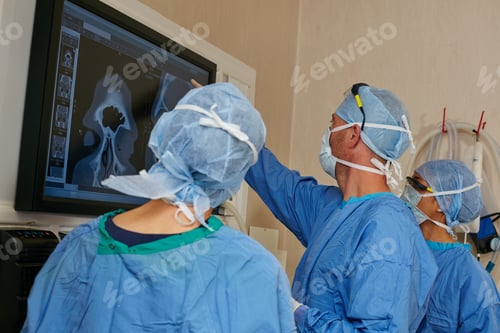 Preview: Surgeons Examining Scan in Hospital Operating Room