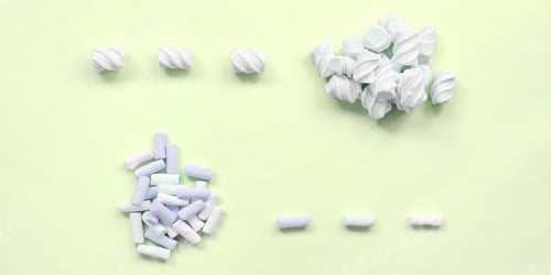 Preview: Colorful marshmallow laid out on lime paper background. pastel creative texture