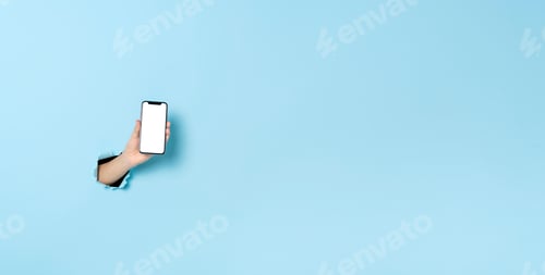 Preview: Woman hand showing mockup smartphone over blue banner background. Panoramic image