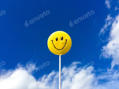 Preview: Smiley emoticon on a stick with blue sky in the background