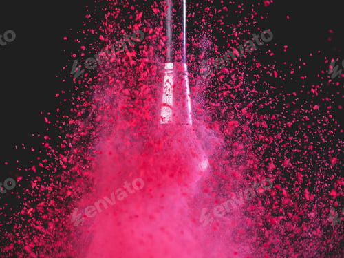 Preview: Make-up brush with pink powder splashes explosion on black background. Beauty concept