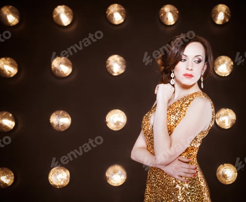 Preview: Superstar woman wearing golden shining dress