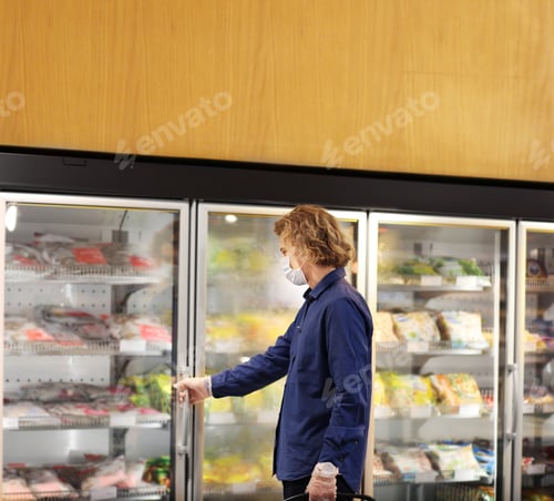 Preview: Supermarket Shopping, Face Mask And Gloves,Man Choosing Frozen Food From A Supermarket Freezer