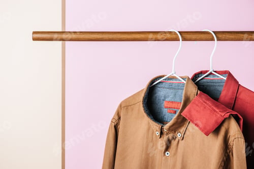 Preview: closeup of trendy shirts on hangers, fashion industry