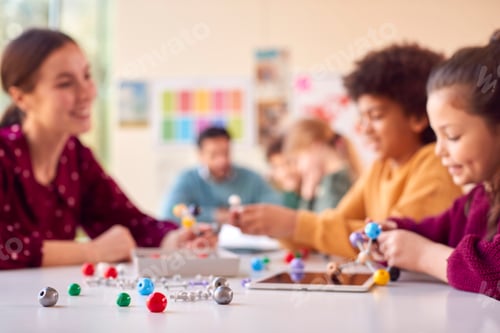 Vista previa: Multi-Cultural Students With Teachers In Classroom Studying Molecular Model In Science Class