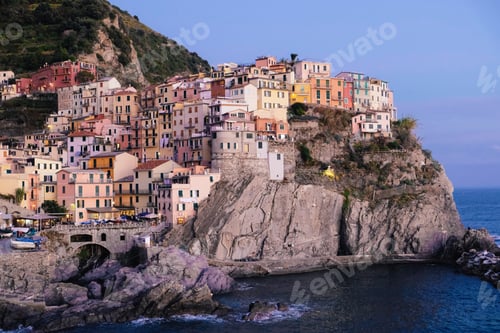 Preview: Rocky hills and colorful historic buildings of Manarola, Italy.