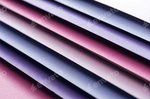 Preview: empty blue, white, pink and purple sheets of paper on pink background