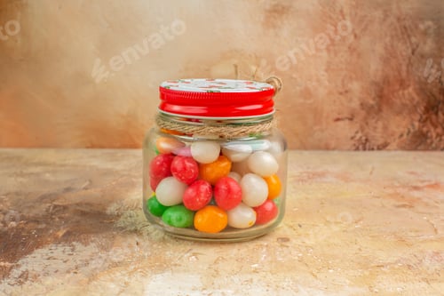 Preview: front view colorful candies inside glass can on light background rainbow sugar sweet goodie