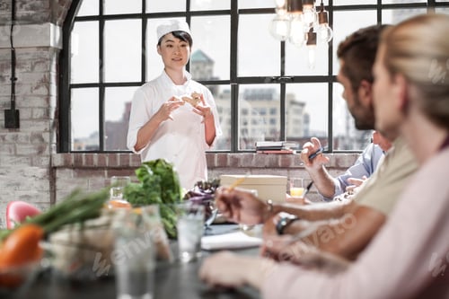 Preview: Female chef talking to students in cooking class