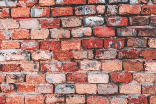 Preview: Weathered Red Brick Wall Background in Urban Setting
