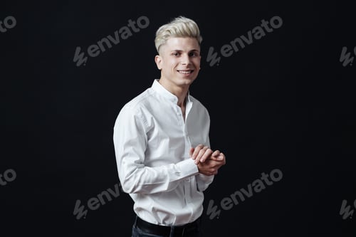 Preview: Smiling man close up portrait against black background