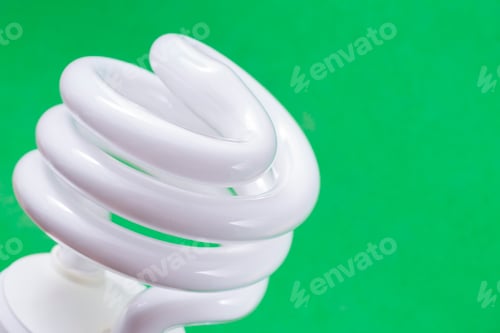 Preview: Fluorescent light bulb on green background, technology that contains polluting gases