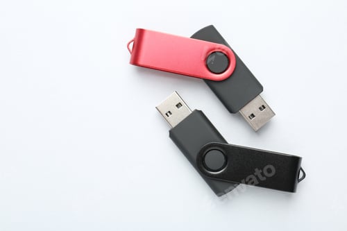 Preview: Flash drives on white background, flat lay