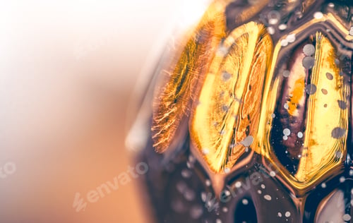 Preview: Macro shot of a silver Christmas ball on a blurred background.