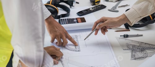 Preview: Civil engineer teams meeting working together wear worker helmets hardhat on construction site in