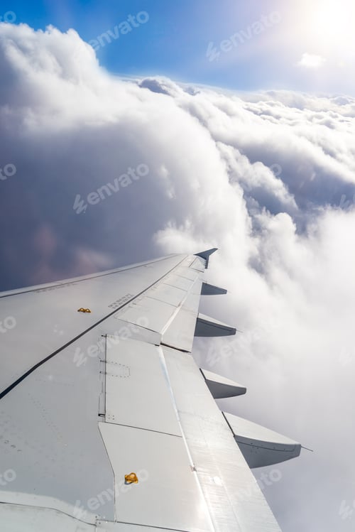 Preview: Wing of an airplane above the clouds