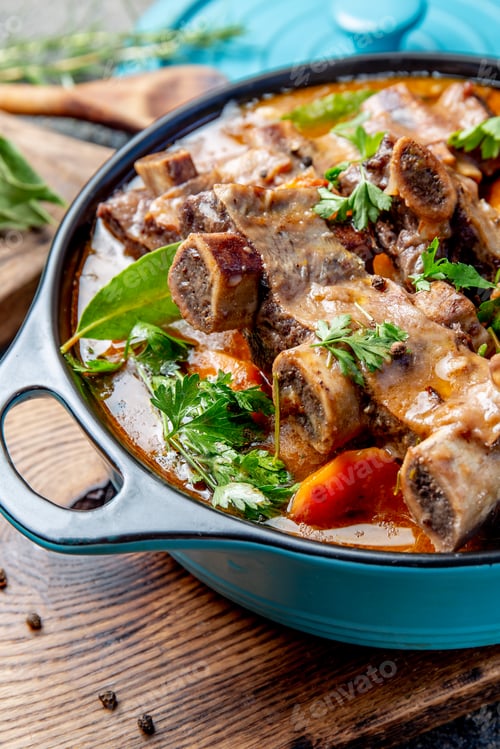 Preview: Beef ribs Bourguignon. Beef ribs stewed with carrot, onion in red wine. France dish. Top view