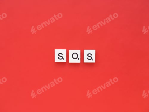 Preview: SOS scrabble letters word on a red background