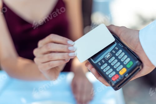 Preview: Close-up view woman using contactless credit card on pos terminal