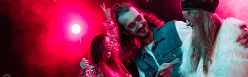Preview: panoramic shot of man giving weed in plastic zipper bag to woman in nightclub