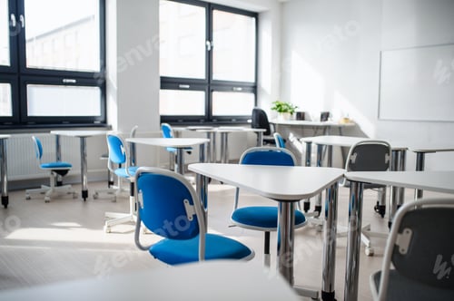 Preview: Desks and chairs in empty classroom. Copy space