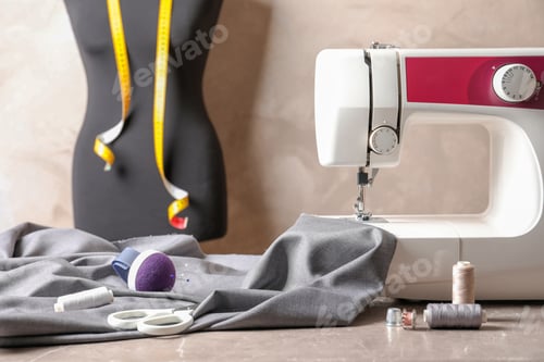 Preview: Sewing Machine, Mannequin, and Fabric on Table