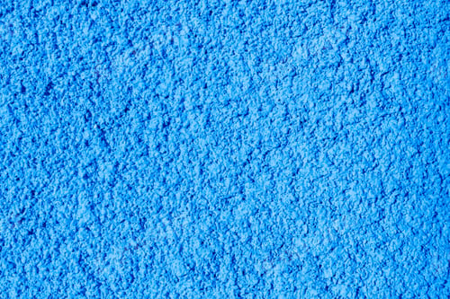 Preview: Beautiful textured plaster background in bright blue color.