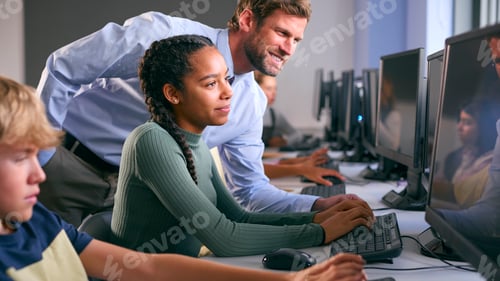 Preview: Multi-Cultural Group Of Secondary Or High School Students At Computers In IT Class With Male Teacher